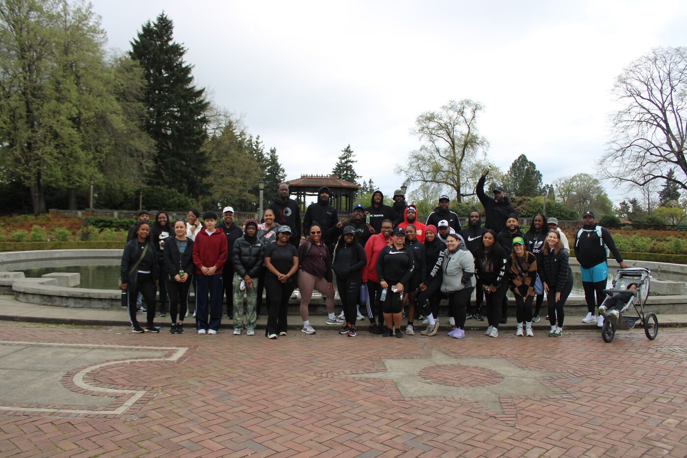 Group posing at a fountain