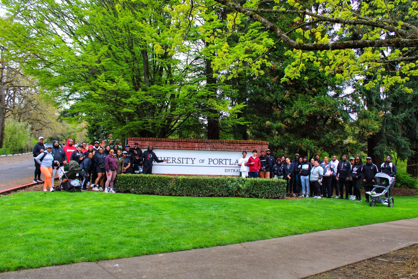 Group photo at University of Portland sign
