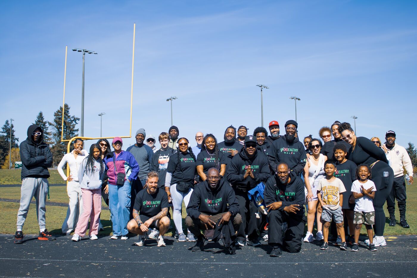 Large group photo on a football field