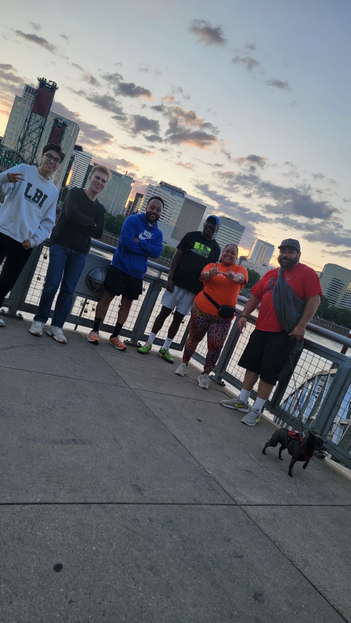 Group photo on a bridge at sunset