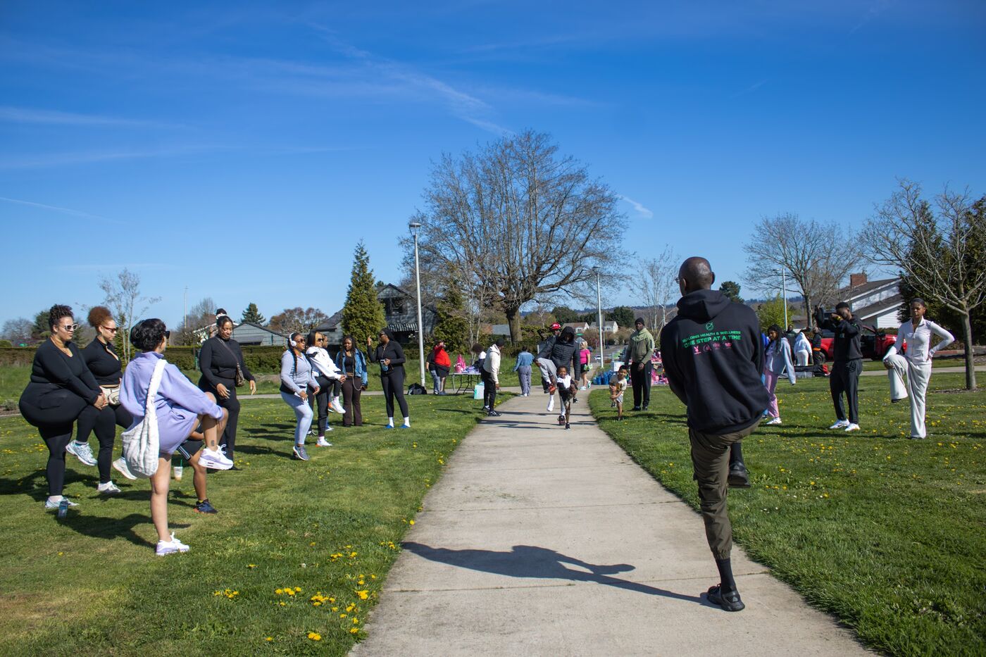 Group stretching in a park before a walk