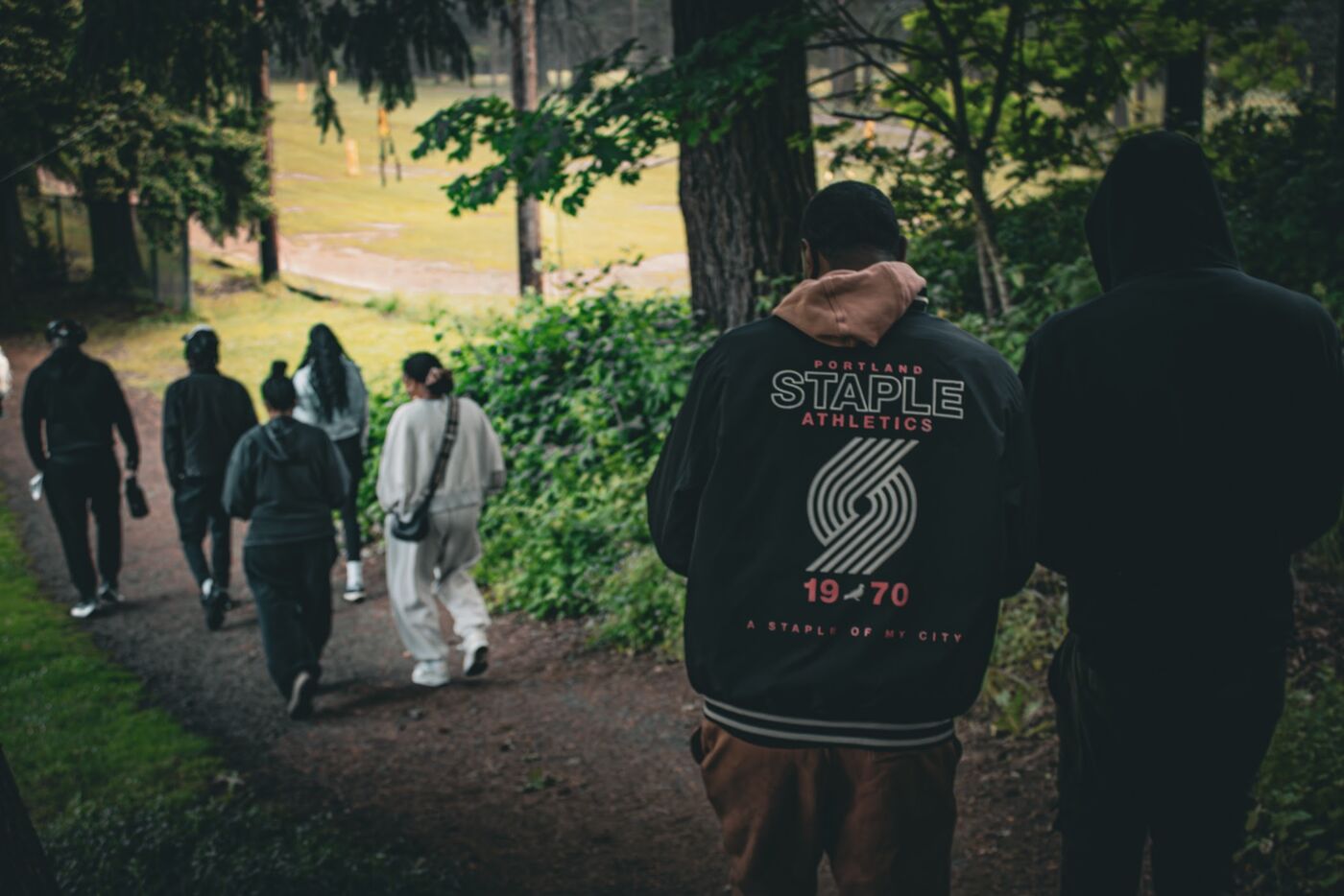 Walkers on a wooded path