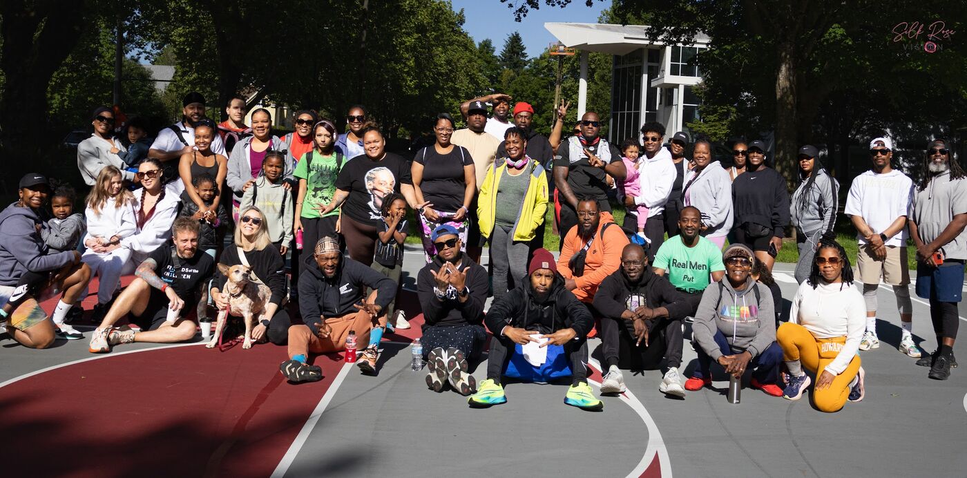 Large group photo on an outdoor court